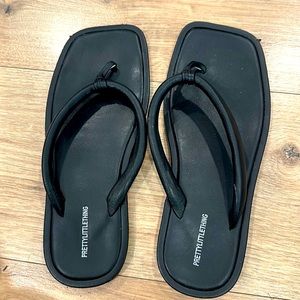 Black, flip-flops, sandals, and slightly worn